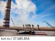 GRES-1 thermal power station roof. Smoke stack, chimneys and construction cranes. blue sky with white cloud. Ekibastuz, Pavlodar region, Kazakhstan. Стоковое фото, фотограф Alexey Rezvykh / Фотобанк Лори