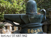 The methal Shiva Linga in Toganji temple. Nagoya. Japan (2007 год). Редакционное фото, фотограф Сергей Пристяжнюк (Serg Zastavkin) / Фотобанк Лори