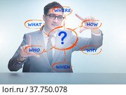 Concept of many different questions asked with businessman. Стоковое фото, фотограф Elnur / Фотобанк Лори