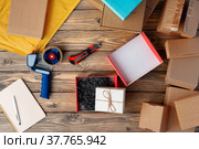 Packing products for delivery on wooden table, top view. Стоковое фото, фотограф Сергей Толмачёв / Фотобанк Лори