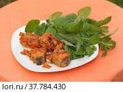 Pike with vegetables and mint sauce on orange background. Стоковое фото, фотограф Марина Володько / Фотобанк Лори