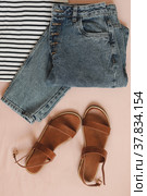 Summer fashion vacation. flat lay composition with female top, denim shorts, sandals top view. Стоковое фото, фотограф Galina kondratenko / Фотобанк Лори