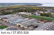 Животноводческая ферма осенью, коровники. Вид с воздуха. Cattle breeding farm in autumn, сowsheds. Aerial view. Стоковое видео, видеограф Евгений Романов / Фотобанк Лори