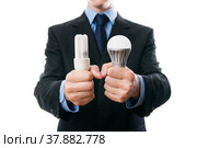 Businessman with fluorescent and LED lamps and incandescent. Стоковое фото, фотограф Станислав Тарко / Фотобанк Лори
