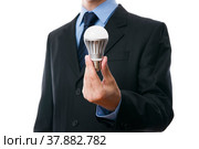 Business man with LED light bulb. Стоковое фото, фотограф Станислав Тарко / Фотобанк Лори