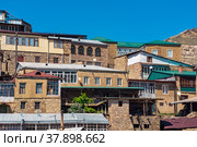 Traditional dwellings are located one above the other along the mountain slope in the ancient village of Chokh in Dagestan. Стоковое фото, фотограф Евгений Харитонов / Фотобанк Лори