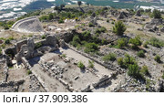 Drone photo of ruins of ancient city Rhodiapolis with view of amphitheater. Antalya Province, Turkey. Стоковое видео, видеограф Яков Филимонов / Фотобанк Лори