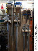 Workplace in the workshop: wall storage of clamps. Стоковое фото, фотограф Марина Шабардина / Фотобанк Лори