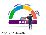 Concept of BMI - body mass index with man. Стоковое фото, фотограф Elnur / Фотобанк Лори