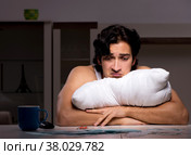 The young man calculating expences night at home. Стоковое фото, фотограф Elnur / Фотобанк Лори