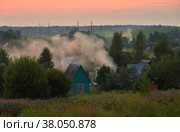 Panorama of Klin-Dmitrovsky ridge with villages with smoke from campfires at sunset in summer, Sergiev Posad district, Moscow region, Russia (2021 год). Стоковое фото, фотограф Алексей Антипов / Фотобанк Лори
