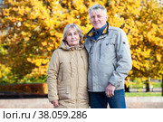 Pension age couple portrait together in autumn city park, happy elder people portrait. Стоковое фото, фотограф Кекяляйнен Андрей / Фотобанк Лори
