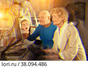 Kids and their grandparents solving riddles in escape room. Стоковое фото, фотограф Яков Филимонов / Фотобанк Лори