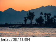 Bright, beautiful sunset on the sea with mountain views. Стоковое фото, фотограф Ярославский Максим / Фотобанк Лори