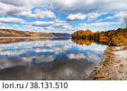 Picturesque autumn landscape of Baikal Lake with reflection of clouds in blue calm water near Shamansky Cape. Стоковое фото, фотограф Виктория Катьянова / Фотобанк Лори