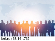 Creative image of silhouettes of businesspeople standing together on abstract background. Стоковое фото, фотограф Сергей Толмачёв / Фотобанк Лори