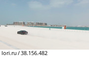 Black sport car test drive on Dubai beach. Стоковое видео, видеограф Aleksey Kidisyuk / Фотобанк Лори