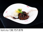 Chocolate flan with vanilla ice cream on a white plate. Стоковое фото, фотограф Марина Володько / Фотобанк Лори