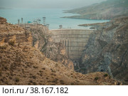 Large arch dam of a hydroelectric power station on a river in a rocky canyon. Dagestan, Russia. Стоковое фото, фотограф Сергей Цепек / Фотобанк Лори