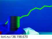 Price of american oil is changing concept. Black barrel with oil and graph. Стоковое фото, фотограф Сергей Толмачёв / Фотобанк Лори
