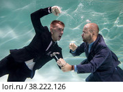Successful businessman elimination of competitor young business start-up with resistance underwater. Live competition and monopolies in work. Concept bad partnership and goal achievement. Copy space. Стоковое фото, фотограф Aleksandr Golubev / Фотобанк Лори