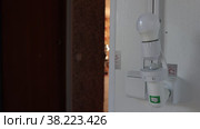 Screw-in holder with motion sensor for light bulb. Стоковое видео, видеограф Владимир Григорьев / Фотобанк Лори