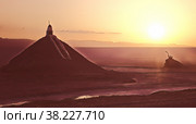 Beautiful gritty landscape of sahara desert. The sunrise at Chott El Jerid, large salt lake in southern Tunisia. Chott El Jerid is largest salt pan of Sahara. Стоковая иллюстрация, иллюстратор Aleksandr Golubev / Фотобанк Лори