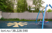 Raindrops on lens. Playground is closed due to pandemic or epidemic. Fenced Playground in rain and bad weather. Self-isolation mode. Stay at home! Стоковое фото, фотограф Aleksandr Golubev / Фотобанк Лори