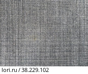 Grey fabric texture. Selective focus, close-up shot of light gray fabric upholstery. Fibrous structure of wool. Colorful design. Wallpaper and background with space for copying text. Стоковое фото, фотограф Aleksandr Golubev / Фотобанк Лори