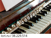 Flute with piano. Flute on piano keys. Wind instrument for musical design of concert creativity. Space for your creativity, creating an inscription or logo. Concept of musical work or concert. Стоковое фото, фотограф Aleksandr Golubev / Фотобанк Лори