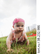 Advertising conception to protect children from tick, health, safe rest, improper behavior, seasonality of bacteria. Blue eyes girl of 8 months in grass is saved from ticks. Perfect child in nature. Стоковое фото, фотограф Aleksandr Golubev / Фотобанк Лори