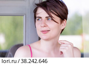 Portrait of a smiling girl looking slyly away. Стоковое фото, фотограф Татьяна Дворецкая / Фотобанк Лори
