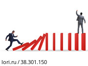 Businessman in domino effect concept. Стоковое фото, фотограф Elnur / Фотобанк Лори