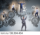 Businessman supporting gear in teamwork concept. Стоковое фото, фотограф Elnur / Фотобанк Лори