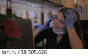 Girl Slavic appearance in medical mask and rubber gloves works with computer-laptop. Стоковое видео, видеограф Aleksandr Golubev / Фотобанк Лори