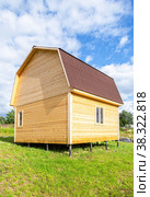 Wooden house under construction on a metal pile foundation. Стоковое фото, фотограф FotograFF / Фотобанк Лори
