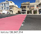 City pedestrian crossings are painted pink to draw attention to month of breast cancer awareness in October (2022 год). Редакционное фото, фотограф Kira_Yan / Фотобанк Лори