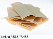 A stack of raw pasta in the form of plates for the Eastern national cuisine. Beshbarmak. Стоковое фото, фотограф Ярославский Максим / Фотобанк Лори