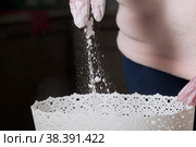 A woman mixes dextrose with powdered sugar. For processing marshmallows. Homemade zephyr. Стоковое фото, фотограф Vadzim Yakubovich / Фотобанк Лори