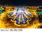 Aerial view to largest light and music fountain in Russia. 2214 colours jets burst into sky with musical accompaniment. Night show "fire on the water" in Nizami Ganjavi Park Derbent, Dagestan, Europe. Стоковое фото, фотограф Алексей Ширманов / Фотобанк Лори