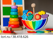 Balancer toys. Children's wooden toy in the form of an umbrella, color pyramid and educational logic toys for children. Montessori Games for child development. Стоковое фото, фотограф Photojuli / Фотобанк Лори