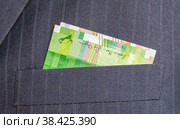 Banknotes of Norwegian krones sticking out of the coat pocket. Стоковое фото, фотограф FotograFF / Фотобанк Лори