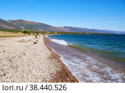 Lake Baikal in early autumn on a sunny day. Waves at the lake shore. Стоковое фото, фотограф Виктория Тельминова / Фотобанк Лори