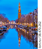 Amsterdam Netherlands canals with lights during evening in December during winter in the Netherlands. Стоковое фото, фотограф Fokke Baarssen / Фотобанк Лори