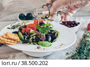 Salad for the correction of the weight of the leaves of Lollo Rosso lettuce, watercress salad and other green herbs with tomatoes, olives and phytacs. Стоковое фото, фотограф Оксана Медведева / Фотобанк Лори