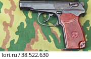 Russian army handgun on camouflaged background. Стоковое видео, видеограф FotograFF / Фотобанк Лори