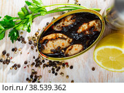 Marinated chipirones in ink with greens and lemon. Стоковое фото, фотограф Яков Филимонов / Фотобанк Лори