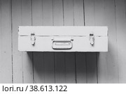 An old suitcase with a handle. Стоковое фото, фотограф Siarhei Starastau / Фотобанк Лори