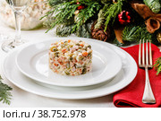 Russian traditional Olivier salad with pea on holiday table background. Стоковое фото, фотограф Лисовская Наталья / Фотобанк Лори