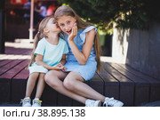 beautiful young girls sit on the veranda and chat. Стоковое фото, фотограф Поликарпов Владимир Владимирович / Фотобанк Лори